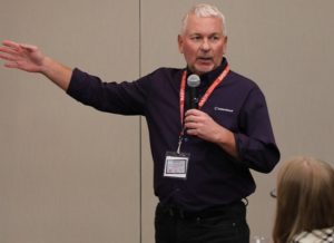 Jim Dobinski presenting to an audience